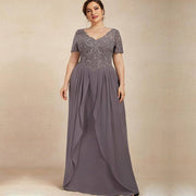 Chiffon long evening gown in muted purple with lace embroidered bodice, short sleeves, and flowing pleated skirt.
