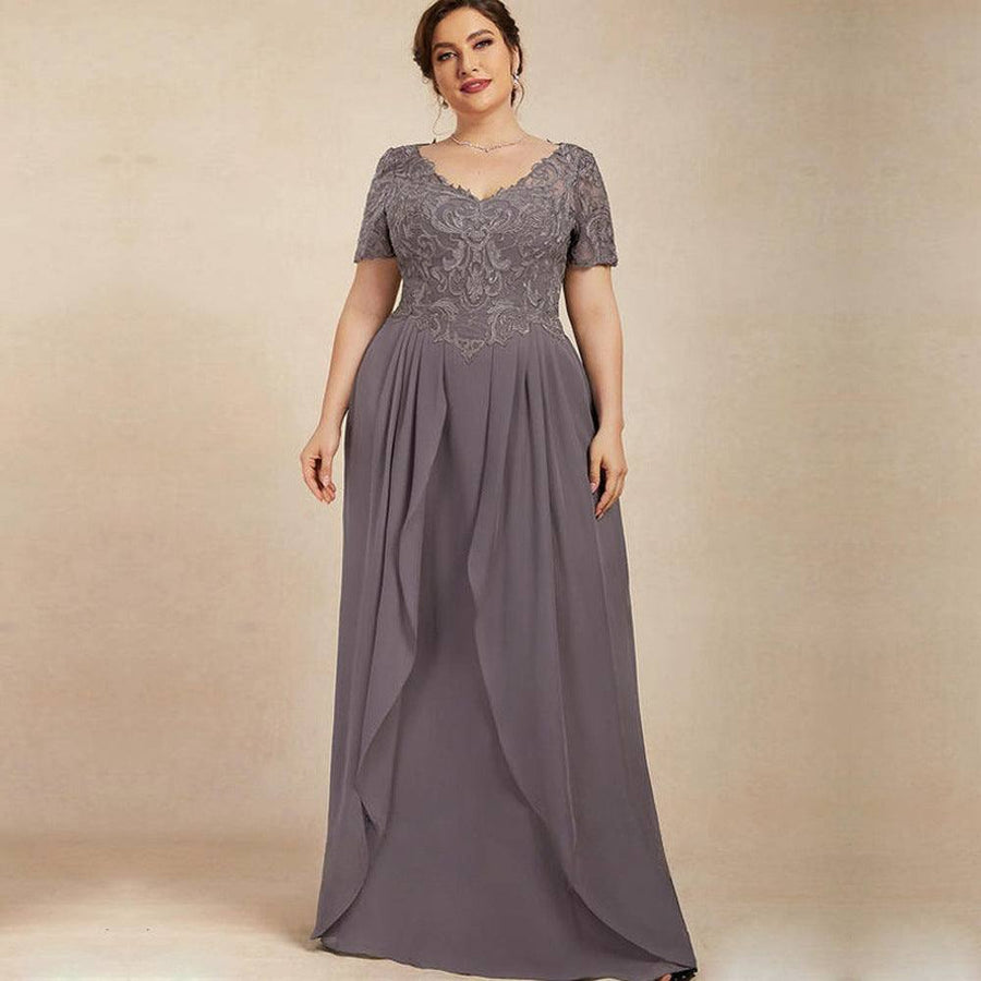 Chiffon long evening gown in muted purple with lace embroidered bodice, short sleeves, and flowing pleated skirt.