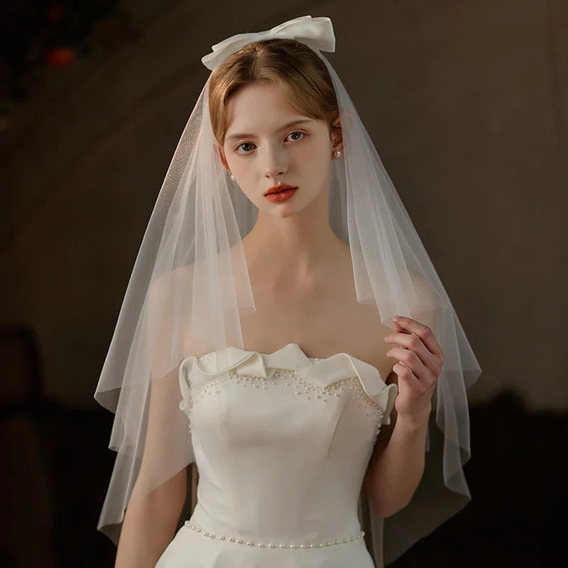 Double-layer mid-length bridal veil with satin ribbon bow made of soft chiffon tulle