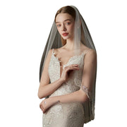 Embroidered soft tulle bridal veil in pure white, lightweight and sheer, perfect for fairy forest wedding style.