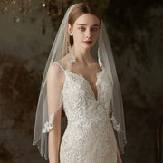 Lace flower beaded bridal veil single-layer long tulle wedding headpiece on mannequin