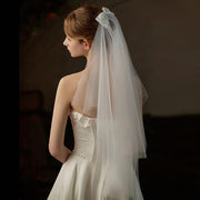 Double-layer mid-length bridal veil with satin ribbon bow and soft chiffon tulle