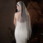 Single-layer beaded lace bridal veil in soft white and beige, lightweight chiffon tulle wedding veil