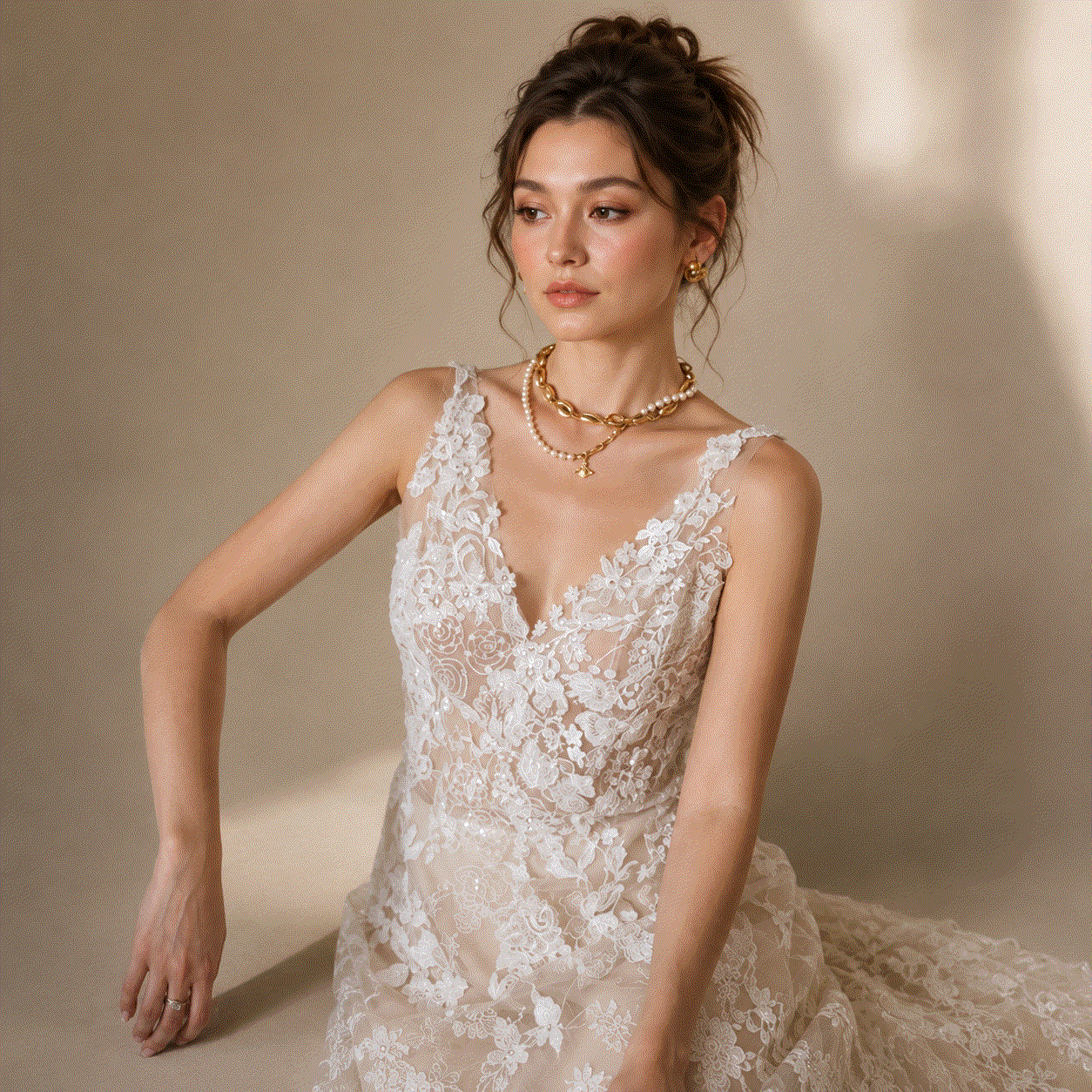 floral lace wedding dress in ivory with embroidered flowers, sheer deep V-neck bodice and a flowing lace skirt