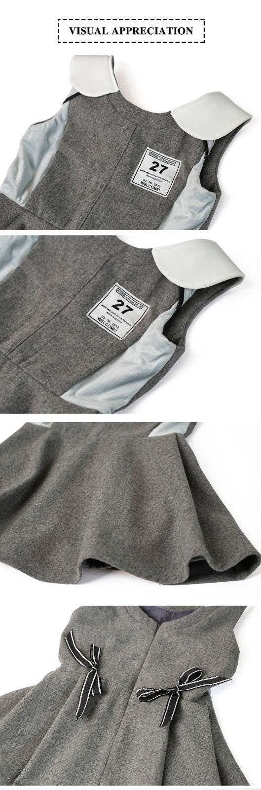 Girls Woolen Sleeveless Sporty Dress in grey textured fabric with white collar and side panels, featuring a chest badge and bow details.