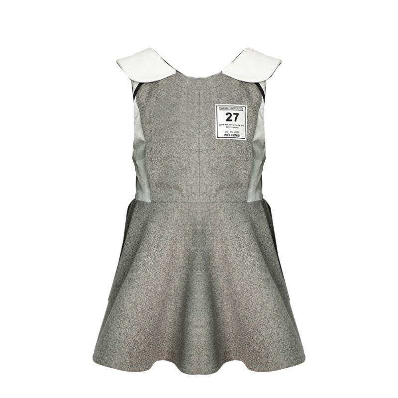 Girls Woolen Sleeveless Sporty Dress in grey wool-look fabric, with a flared skirt, white collar and number patch.