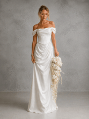 Ivory satin off-shoulder corset wedding guest dress with elegant draped waist and floor-length silhouette