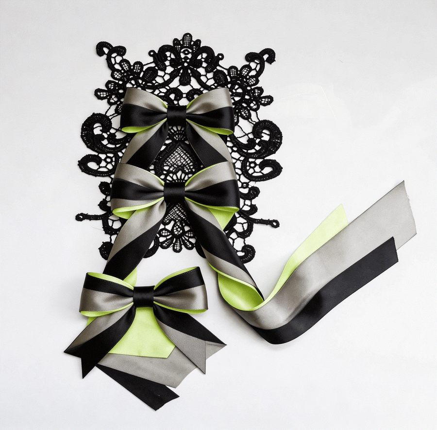 Elegant lace and satin ribbon arranged in a romantic DIY styling set for weddings and occasions