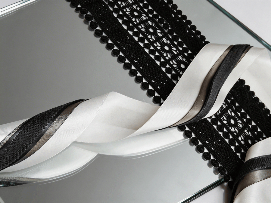 Ivory and charcoal satin ribbons set with layered widths for elegant wedding and gift styling