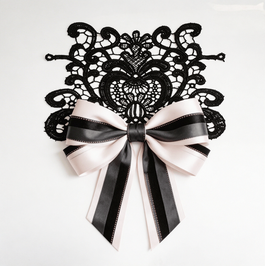 Blush structured lace set with black textured and grey layered ribbons featuring floral lace applique for elegant wedding decor and styling