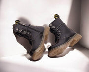 Kids Black Matte Leather Boots with black lace-up uppers, metal eyelets, side zips and chunky tan lug soles