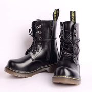 Kids Black Matte Leather Boots in black glossy leather, with lace-up fronts, side zippers, metal eyelets and yellow-stitched soles.
