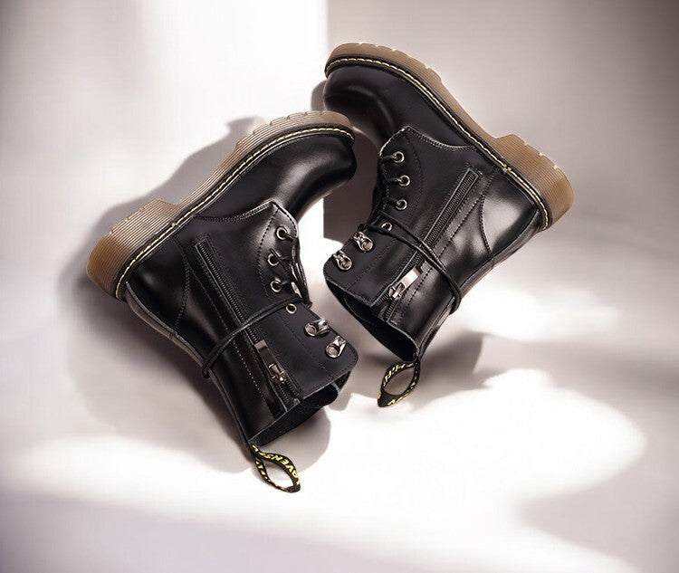Kids Black Matte Leather Boots in glossy black leather, with lace-up fronts, side zips and thick tan lug soles.