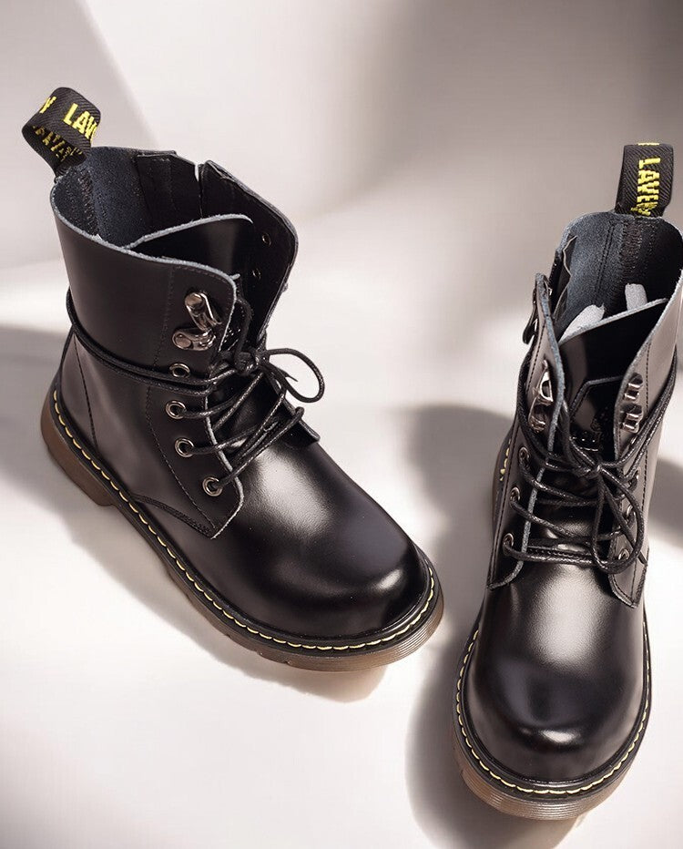 Kids Black Matte Leather Boots in black with a smooth finish, lace-up fronts, side zips and yellow stitching on thick soles.