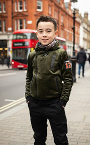 Kids' Velvet Blazer in dark olive green with a zip front, hood, chest pocket, and orange sleeve patch; not velvet.