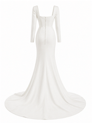 Mermaid wedding dress in white smooth crepe, with a square neckline, long sleeves, covered back buttons and a chapel train